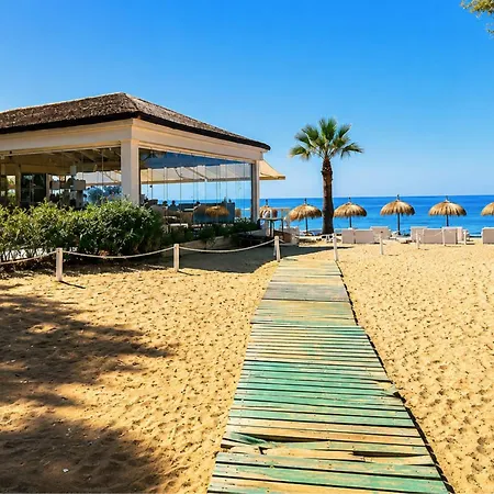 Relaxed Mediterranean Living With A Private Garden & Beachside Location